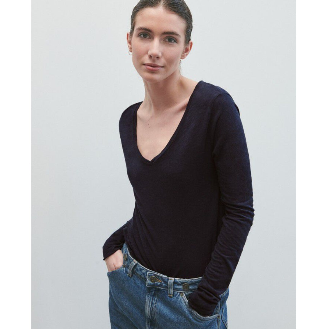 American Vintage Jac52 long sleeved t-shirt in navy available to buy from Stripes a UK stockist. Modelled tucked into blue jeans