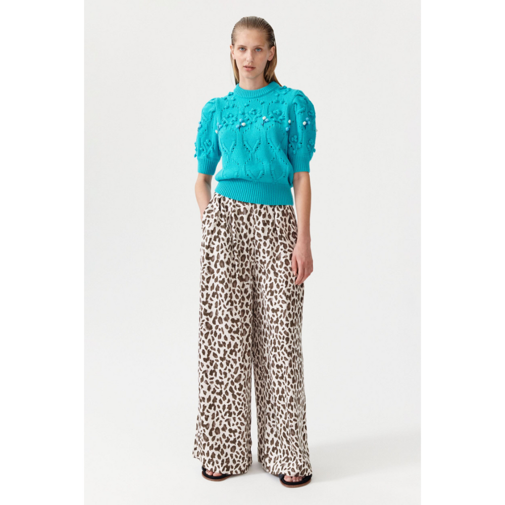 Buy Baum und Pferdgarten UK Nataly Trousers seen here on a model with a turquoise knitted top.